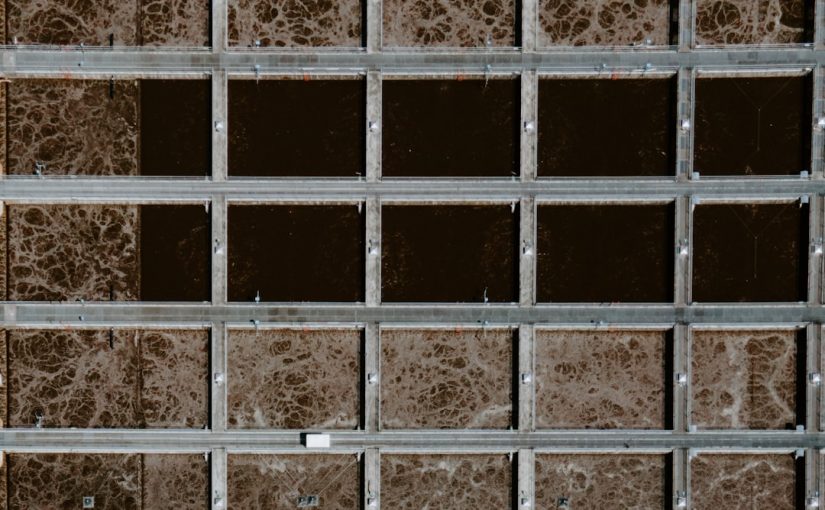 black metal frame on brown concrete wall