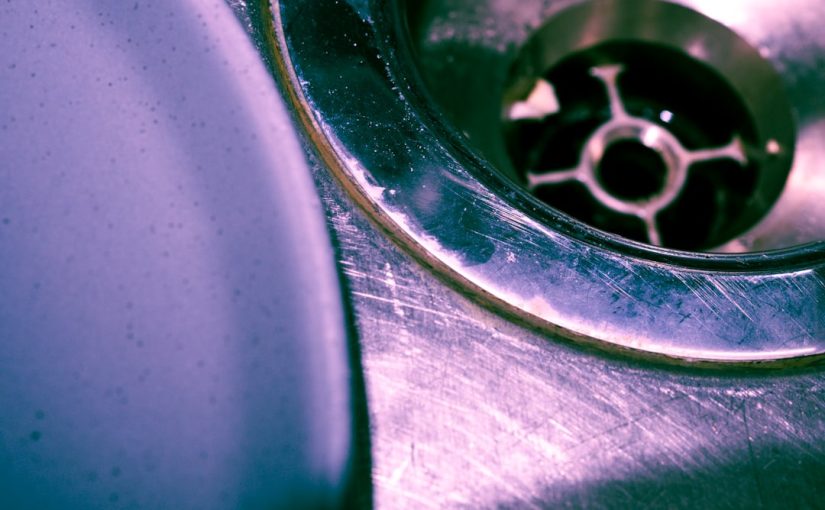 Close up of a stainless steel sink drain